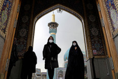 Iranian women leave Imamzadeh Saleh shrine after Tehran reopened following a two-week shutdown, amid the coronavirus disease (COVID-19) outbreak, Iran December 5, 2020. Picture taken December 5, 2020. 