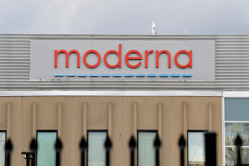 The Moderna logo is seen at the Moderna campus in Norwood, Massachusetts on on December 2, 2020, where the biotechnology company is mass producing its Covid-19 vaccine. The US hopes to have immunized 100 million people against Covid-19 by the end of February, a top official said on December 2, which is approximately 40 percent of the country's adult population. The push should start within weeks, when vaccines developed by Pfizer-BioNTech and Moderna-NIH are expected to be approved.
