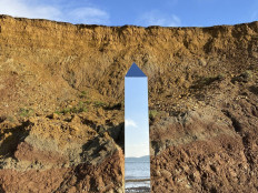 A handout picture released courtesy of the Twitter feed of @AlexiaRFishwick shows an obelisk standing on Compton Beach on the southern western coast of the Isle of Wight on December 6, 2020. 