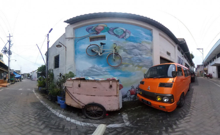 Do not park: A wall installation in Kampung Petemasan called 'Untitled' by UPTOWN CREW depicts the artists’ opinion on climate change.