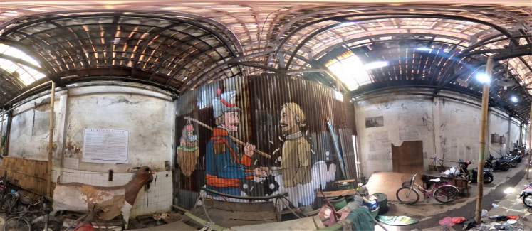Backroom deal: Titled 'Akad' (Contract), a mural in Kampung Bustaman created by the Rezto SAM crew on a corrugated zinc sheet depicts a colonial authority taking away resources from Indonesia.