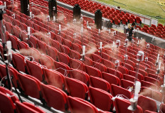 Scientists spray saliva-like droplets in stadium to study how fans spread aerosols