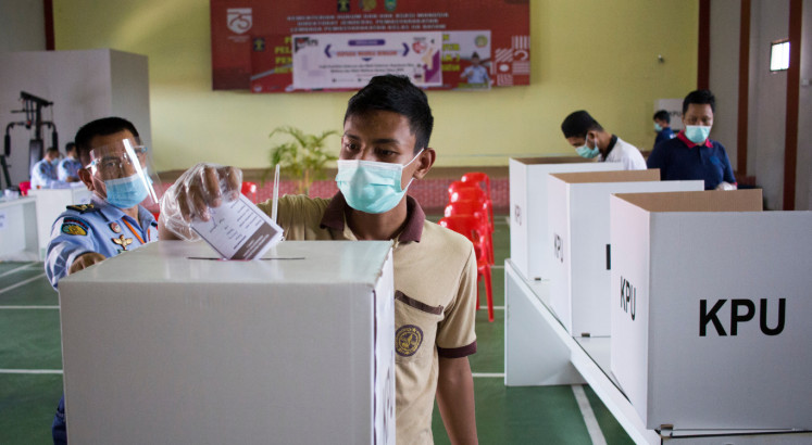 Voters cast ballots in simultaneous regional elections amid pandemic