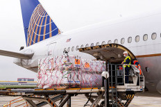 A shipment of Pfizer's coronavirus disease (COVID-19) vaccines is unloaded from a United Airlines cargo-only flight from Brussels to O'Hare International Airport in Chicago, Illinois, U.S. December 2, 2020. Picture taken December 2, 2020.  