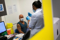 EU begins vaccine rollout as new virus strain spreads