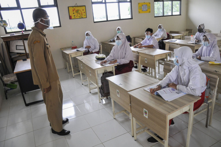 A number of students join a simulation for future in-class learning, which is set to run in January 2021, at SDN Karang Raharja o2 state elementary school in Cikarang, Bekasi regency, West Java on Tuesday, Dec. 15, 2020. 