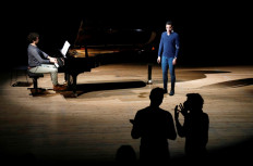 Pianist Felix Ramos and singer Fernando Escalona, members of the Opera de Paris Academy, rehearse at the Bastille Opera in Paris as French theaters, cinemas and museums which have been on the second-wave COVID-19 lockdown will not reopen this year in France, on December 11, 2020. 