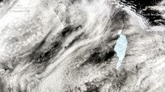 Massive iceberg pivots, breaks near south Atlantic penguin colony island