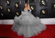 In this file photo taken on January 26, 2020, US singer-songwriter Ariana Grande arrives for the 62nd Annual Grammy Awards in Los Angeles. Ariana Grande announced on December 21, 2020 she is engaged in a series of photos of her and her fiance, Dalton Gomez, a luxury real estate agent, and her engagement ring.