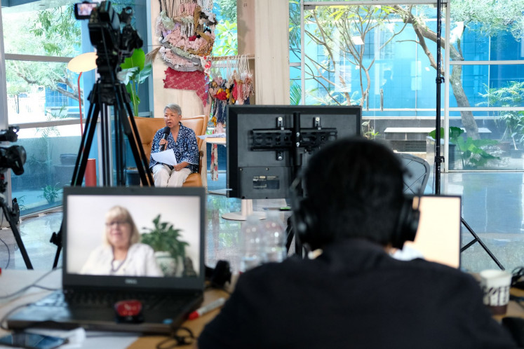 Through foreign lens: Australian author Jennifer Mackenzie (pictured on computer) is seen in one of the discussions at the Lontar Literary Festival 2020 in November. 