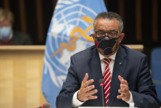 This handout picture taken and released by the World Health Organization on October 5, 2020 shows World Health Organization (WHO) Director-General Tedros Adhanom Ghebreyesus wearing a protective face mask attending a WHO executive board holds special session on the COVID-19 response at the health agency's hesdquarters in Geneva. 