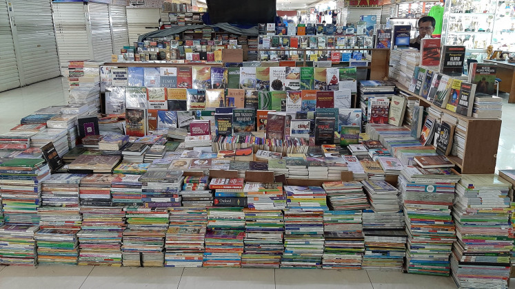 Crowded with books: Piles of books are seen at the center for cheap books that are new, old or rare at Blok M Square, South Jakarta.