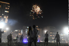 World ushers in New Year in shadow of pandemic 