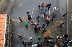 Tractors to Twitter: India's protesting farmers battle on highway, online