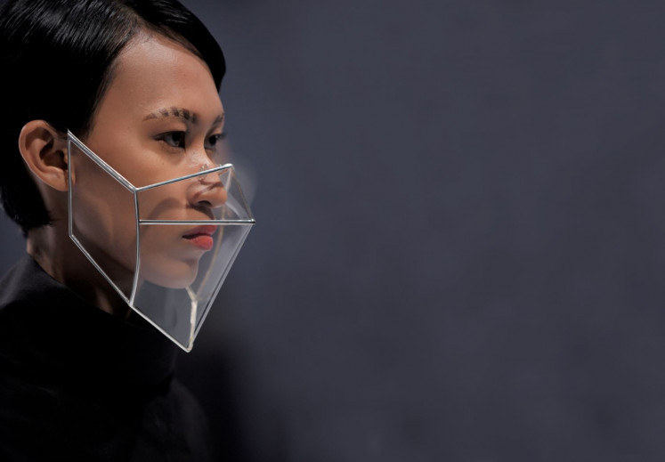 Into the future: A model sports a structured face shield made of crinoline and designed by renowned accessories designer Rinaldy A. Yunardi. 