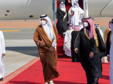 Saudi Arabia's Crown Prince Mohammed bin Salman welcomes Qatar's Emir Sheikh Tamim bin Hamad al-Thani upon his arrival to attend the Gulf Cooperation Council's (GCC) 41st Summit in Al-Ula, Saudi Arabia Tuesday. 