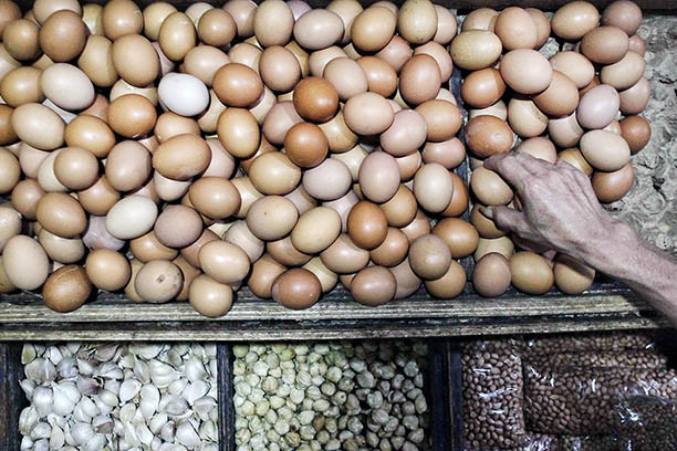 Fragile situation: A vendor handles eggs on Tuesday at Tebet Barat Market in South Jakarta. 