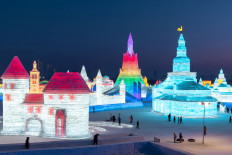 Frozen towers and palaces stun visitors at Harbin ice festival 