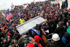 Protesters clash with Capitol police during a rally to contest the certification of the 2020 US presidential election results by the US Congress, at the US Capitol Building in Washington, US, Wednesday. 
