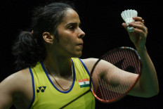 India's Saina Nehwal serves against Spain's Carolina Marin during their women singles quarter-final match at the Malaysia Open badminton tournament in Kuala Lumpur on January 10, 2020. 