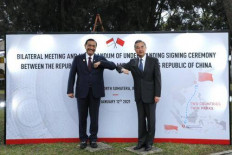Coordinating Maritime Affairs and Investment Minister Luhut Binsar Pandjaitan (left) greets visiting Chinese foreign minister Wang Yi in  Parapat, North Sumatra on Jan. 12, 2021.