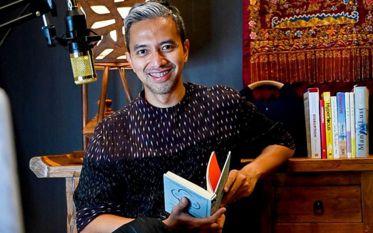 Fashion designer Didiet Maulana poses in his home office, from where he provides online entrepreneurship classes, in this undated photo.