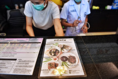 This photo taken on January 15, 2021 shows the special menu of Thai dishes cooked with cannabis leaves at the Abhaibhubejhr Spa Cuisine restaurant at the Abhaibhubejhr Day Spa, next to Chao Phraya Aphaiphubet Hospital in Prachinburi. 