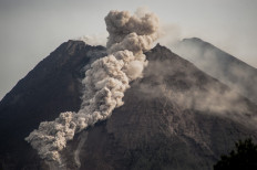Mount Merapi, Indonesia’s most active volcano, spews rocks and gas for another day in Yogyakarta on January 27, 2021.
