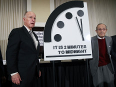 Former California Governor Jerry Brown, (left) and former U.S. Secretary of Defense William Perry unveil the Doomsday Clock during The Bulletin of the Atomic Scientists news conference, on January 24, 2019 in Washington, DC. This year the Doomsday Clock remains unchanged and is set at two minutes to Midnight. 