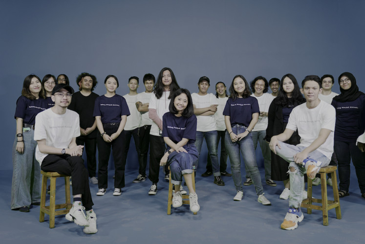 Peer-to-peer: The Menjadi Manusia cofounders (sitting, from left) Adam Abednego, Levina Purnamadewi, Rakha Ghanisatria, and the team provide video content to raise people's awareness about mental health issues.