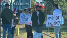 Protesters carrying signs demanding the end of lockdowns and promoting anti-vaccination conspiracy theories gathered at the entrance to a vaccination site in Los Angeles on January 30, 2021.
