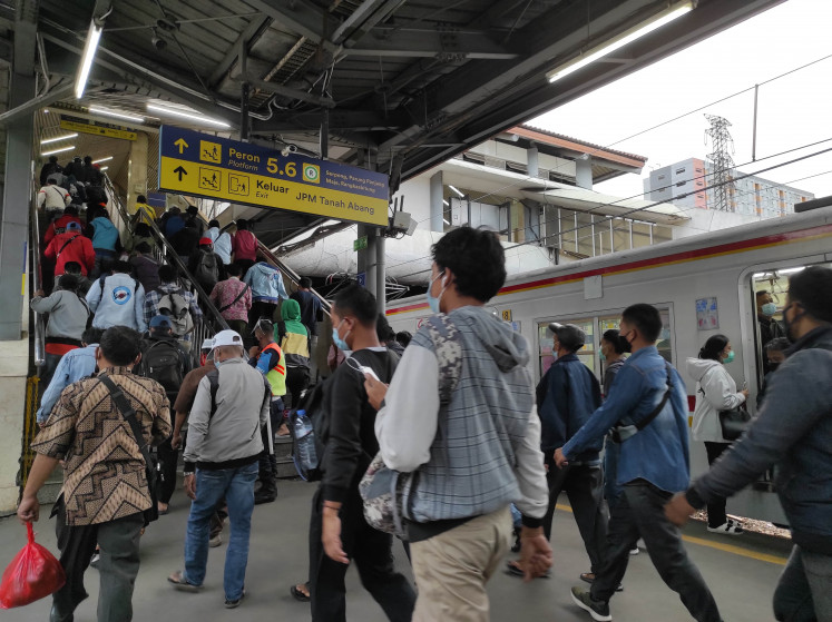 Commuters crowd Tanah Abang Station, one of Jakarta's busiest commuter line stations, after office hours on Jan. 28.