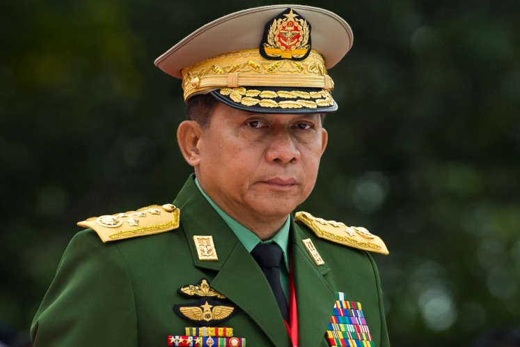 In this file photo taken on July 19, 2018, Myanmar's Chief Senior General Min Aung Hlaing, commander-in-chief of the Myanmar armed forces, arrives to pay his respects to Myanmar independence hero General Aung San and eight others assassinated in 1947, during a ceremony to mark the 71th anniversary of Martyrs' Day in Yangon. Myanmar's military seized power in a bloodless coup on February 1, 2021, detaining democratically elected leader Aung San Suu Kyi as it imposed a one-year state of emergency. 