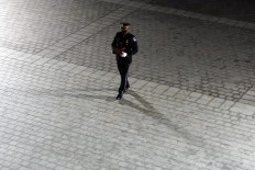 An honor guard carries an urn with the cremated remains of US Capitol Police officer Brian Sicknick up the steps of the US Capitol to lie in honor in the Rotunda, February 2, 2021, in Washington, DC. US President Joe Biden paid his respects Tuesday at a solemn memorial to the policeman killed last month during an attack on the Capitol by Donald Trump's supporters.
