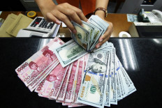 BI holds rate at record low of 3.5% to shield rupiah