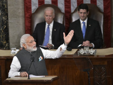 India's Prime Minister Narendra Modiaddresses a joint meeting of Congress at the US Capitol in Washington, DC on June 8, 2016. Looking on(Rear) are then US Vice President Joe Biden(left) and House Speaker Paul Ryan(right).