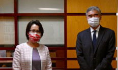 Taiwan's defacto ambassador in Washington, Hsiao Bi-khim, poses for a photo with Sung Kim, acting US Assistant Secretary of State for East Asian and Pacific Affairs, on Feb. 11, 2021.