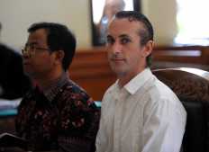 In this file photo taken on March 13, 2017 Britain national David Taylor (right) attends his trial at a court in Denpasar on Indonesia's resort island of Bali. Taylor, who was jailed with his Australian girlfriend for beating a Bali policeman to death is to be freed on February 11, 2021 after more than four years in prison.