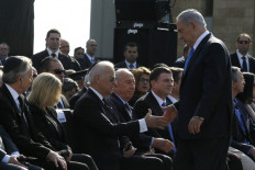 Israeli Prime Minister Benjamin Netanyahu shakes hands with US Vice President Joe Biden during a state memorial service for former Israeli prime minister Ariel Sharon outside the Knesset (Israeli Parliament) in Jerusalem, on January 13, 2014. 
