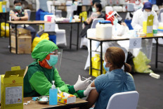 Medical workers undergo mass COVID-19 vaccination drive at Istora Senayan indoor stadium in Jakarta on Feb. 4, 2021. The government aimed to inoculate around 1.5 million medical workers in the first phase of the national COVID-19 vaccination program.