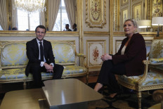 French President Emmanuel Macron (left) attends a meeting with French far-right Rassemblement National (RN) party leader Marine Le Pen at the Elysee Palace in Paris, France, on February 6, 2019.
