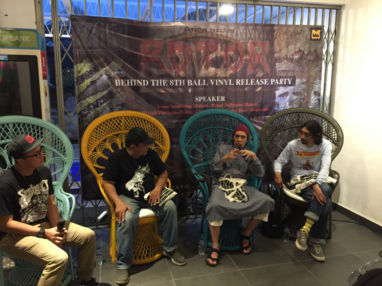 Lead singer of Indonesia's metal band Irvan Sembiring (second from right) speaks during a discussion to celebrate the seminal thrash record Behind the 8th Ball in South Jakarta on Jan. 9, 2021.