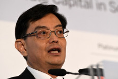 Singapore Finance Minister Heng Swee Keat delivers a keynote address at the 8th World Bank-Singapore infrastructure Finance Summit in Singapore on April 5, 2018. 