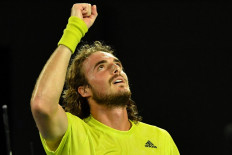 Greece's Stefanos Tsitsipas celebrates after victory against Spain's Rafael Nadal during their men's singles quarter-final match on day ten of the Australian Open tennis tournament in Melbourne on February 17, 2021. 