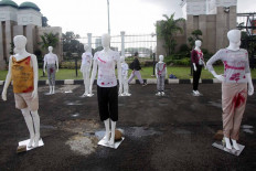 Mannequins are placed outside the Senayan legislative compound in Central Jakarta on Dec. 8, 2020 in a lobbying campaign pushing for the passage of the sexual violence eradication bill. 
