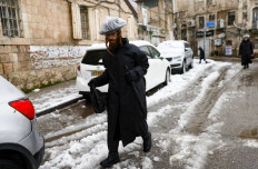 Jerusalem's Old City turns white after rare snowfall