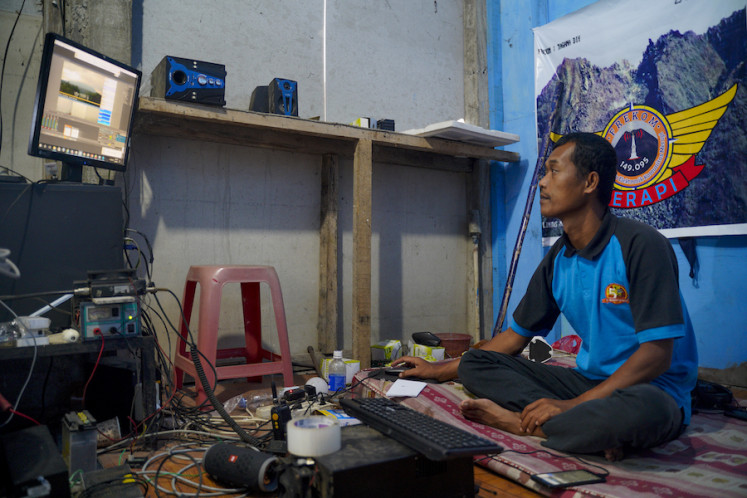 Suparjo controlling the livestream broadcast in Frekom's studio, a 2x2 room built on his front
porch