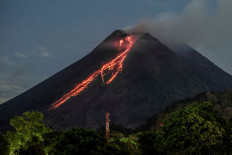 Lava flows down from the crater of Mount Merapi as seen from Kaliurang, in Yogyakarta on February 19, 2021.
 (Agence France Presse/AGUNG SUPRIYANTO ).
Usage: 0