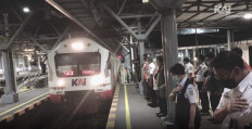 Officers assemble to commemorate the final trip of the Prambanan Ekspres (Prameks), departing from Solo Balapan Station in Surakarta, Central Java, on Feb. 9.