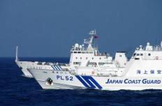 This handout picture taken by the Japan Coast Guard on February 4, 2013 shows a Chinese marine surveillance ship (back L) alongside a Japan Coast Guard ship near the disputed islets known as the Senkaku islands in Japan and Diaoyu islands in China, in the East China Sea. Two Chinese government ships on February 4 entered waters around the Tokyo-controlled islands that Beijing claims as it own. Beijing has repeatedly sent ships to the area since Japan nationalised some islands in the chain in September. 